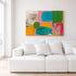 Kerri Rosenthal abstract art print hung above a white sofa in a living room