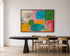 Kerri Rosenthal abstract art print hanging above a wood dining table