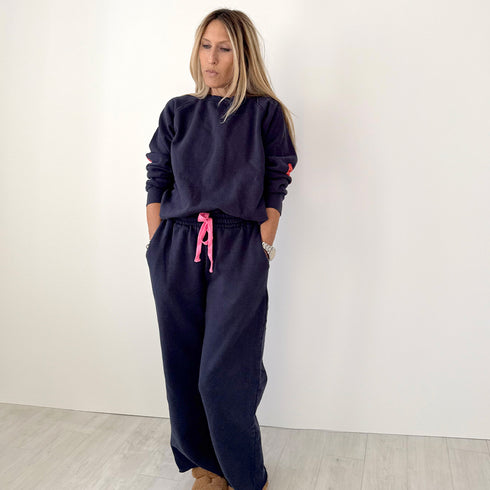 The Benton Imperfect heart patch elbow sleeve indigo blue sweatshirt is made from 100% cotton fleece - Shop cute women’s sweatshirts by Kerri Rosenthal