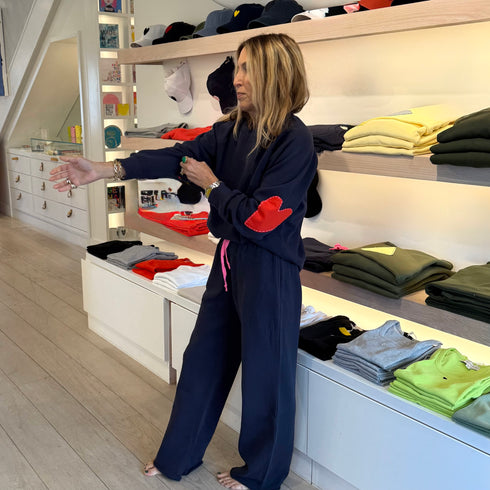 The Benton Imperfect heart patch elbow sleeve indigo blue sweatshirt is made from 100% cotton fleece - Shop cute women’s sweatshirts by Kerri Rosenthal