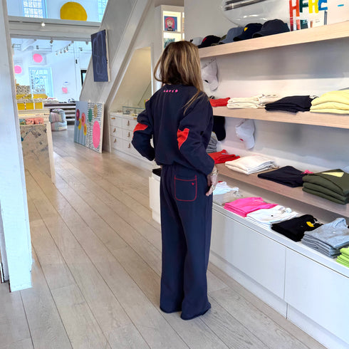 The Benton Imperfect heart patch elbow sleeve indigo blue sweatshirt is made from 100% cotton fleece - Shop cute women’s sweatshirts by Kerri Rosenthal