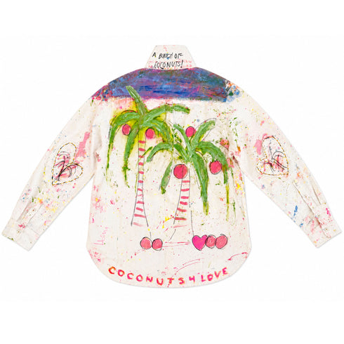 White button-down shirt hand-painted on the back with two green palm trees and pink coconuts, a blue-purple painted sky along the yoke, 'A Bunch of Coconuts!' text on the collar, heart outlines on both sleeves, and 'Coconuts 4 Love' script at the hem — Kerri Rosenthal wearable art