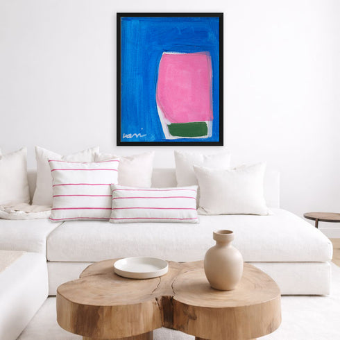 Color Note 6 blue abstract wall art print with pink stripe decorative throw pillows on couch by Kerri Rosenthal