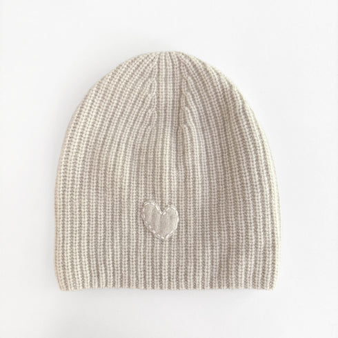 The cream cashmere beanie hat with ribbed knit and a heart patch - Shop cute women’s beanies and hats by Kerri Rosenthal