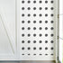 Dottie Wallpaper in Carbon black polka dot on white ground wallpaper for home and office decor