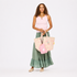 Women's flowy amalfi green tiered maxi skirt with pink tank and pink toile tote. Shop Kerri Rosenthal