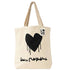 A cream-colored canvas tote bag with a black dripping heart graphic and the word 'LOVE' printed in a white square on the upper right side. The bag has two beige shoulder straps and a black script graphic underneath the heart.