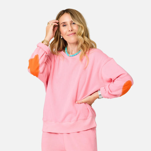 Pink sweatshirt with heart elbow patches - Shop women’s stylish heart sweatshirts by Kerri Rosenthal.