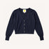 Flat lay of a Kerri Rosenthal navy cotton v-neck cardigan with gold heart buttons and yellow heart logo label."