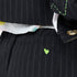 Close-up of black pinstripe blazer cuff and pants pocket detail, featuring colorful artwork lining and a neon green heart embroidery.