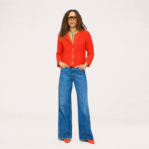 Kerri Rosenthal vermillion boucle tweed fringe jacket with gold heart buttons flat lay.