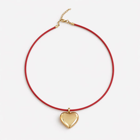 Kerri's puff heart necklace with plush gold heart pendant and genuine leather cord
