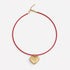 Kerri's puff heart necklace with plush gold heart pendant and genuine leather cord
