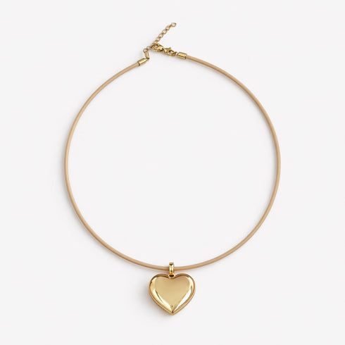 Kerri's puff heart necklace with plush gold heart pendant and genuine leather cord