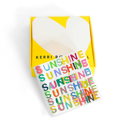 Here Comes The Sun Block of Love by Kerri Rosenthal. Blocks of Love are signed, mini editions of Kerri Rosenthal's word artwork mounted on 3/4" plexiglass acrylic block