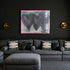 Holding Hearts art print by Kerri Rosenthal with three black hearts and grey ground and pink outline in a black frame displayed on a living room wall with black couch with Kerri Rosenthal Lemonade pillows and black wall treatment.