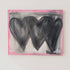 Abstract painting with three black hearts on a pink background, signed 'Kerri, in a minimalistic setting.
