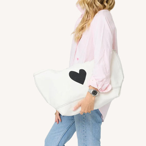 The Imperfect Heart white canvas tote bag is a classic Kerri piece. Gently structured, bag charm, fits your laptop and spare flats - Shop cute totes by Kerri Rosenthal.