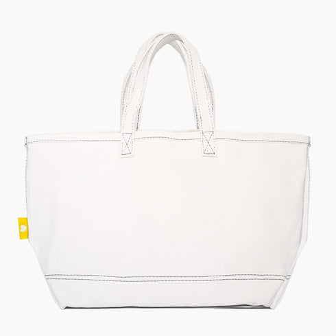 Imperfect heart white canvas tote is an everyday essential made from cotton with a heart graphic and heart charm - Shop cute tote bags by Kerri Rosenthal