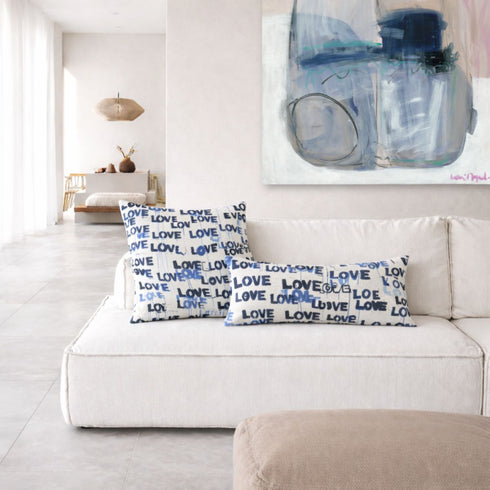 Love Letters indigo blue square and rectangular lumbar decorative throw pillows on couch by Kerri Rosenthal