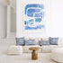 Indigo blue maze wall art print artwork and stripe decorative throw pillow on couch by Kerri Rosenthal
