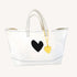 The Imperfect Heart white canvas tote bag is a classic Kerri piece. Gently structured, bag charm, fits your laptop and spare flats - Shop cute totes by Kerri Rosenthal.