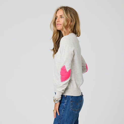 Women's crewneck cashmere sweater with pink heart elbow patches, 100% lightweight cashmere, designed by Kerri Rosenthal