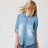 Blue denim long sleeve button-up shirt with heart elbow patches. Cute designer shirts by Kerri Rosenthal