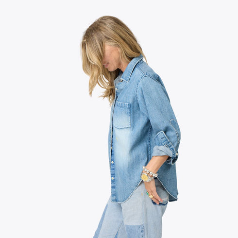 Blue denim long sleeve button-up shirt with heart elbow patches. Cute designer shirts by Kerri Rosenthal