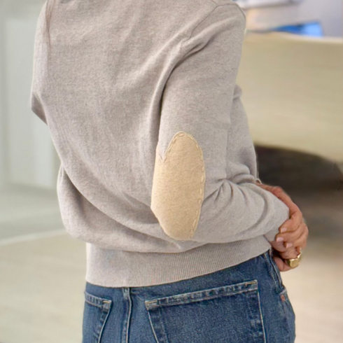 Grey patchwork crewneck sweater with imperfect heart patches on elbows in a soft cotton-cashmere blend. Cute women's sweaters by Kerri Rosenthal