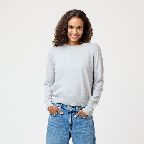 Grey patchwork crewneck sweater with imperfect heart patches on elbows in a soft cotton-cashmere blend. Cute women's sweaters by Kerri Rosenthal