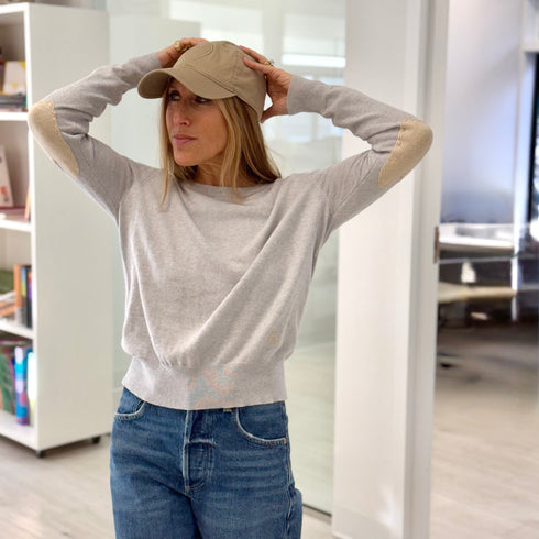 Grey patchwork crewneck sweater with imperfect heart patches on elbows in a soft cotton-cashmere blend. Cute women's sweaters by Kerri Rosenthal