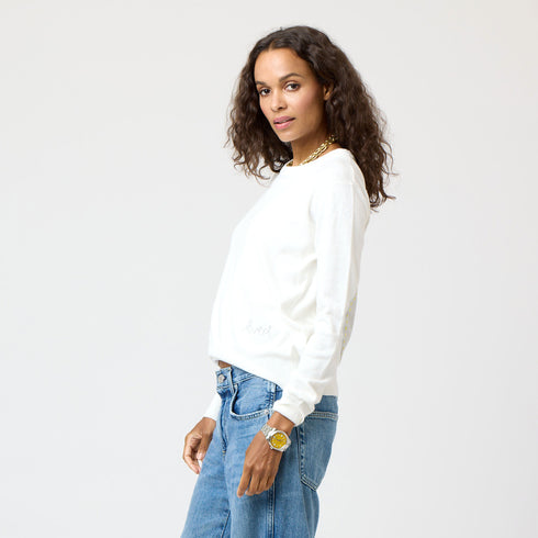 White Patchwork Crew Neck Sweater with imperfect heart patches on elbows in a soft cotton-cashmere blend. Cute women's sweaters by Kerri Rosenthal