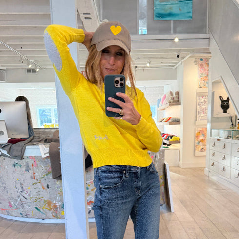 Yellow Patchwork Crewneck Sweater with imperfect heart patches on elbows in a soft cotton-cashmere blend. Cute women's sweaters by Kerri Rosenthal