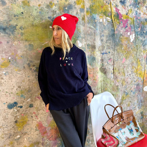 Love cherri red beanie in a cotton-cashmere blend with a white heart patch - Shop cute women’s beanies hats by Kerri Rosenthal
