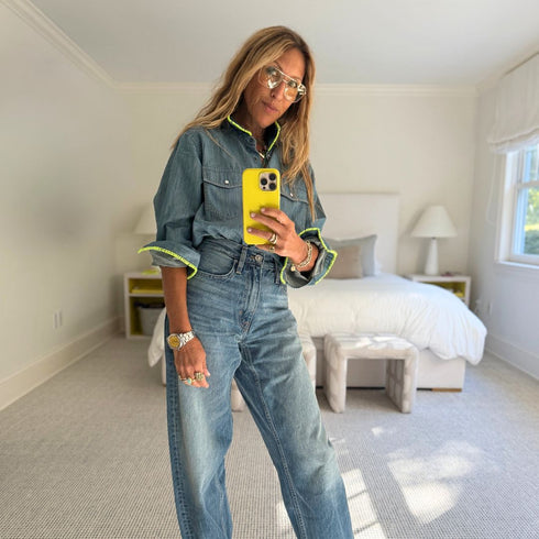 Western-style denim shirt with neon green stitching, chest pockets and a relaxed fit. made from 100% cotton with a button front.