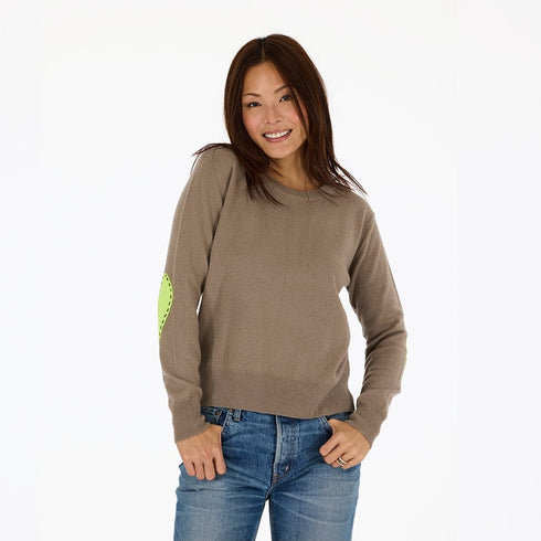 Soft lightweight cashmere with imperfect Mushroom with yellow heart elbow patches and a classic crewneck effortlessly charming and cozy