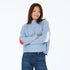 Marlow imperfect heart sweater is back in steel blue 100% cotton with a soft mock-neck and heart patchwork elbow - Shop cute sweaters by Kerri Rosenthal