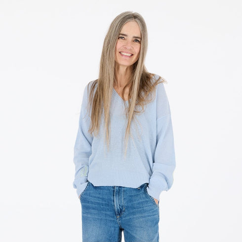 Cashmere pullover in soft blue with stitched on and on forever sleeve and heart elbows