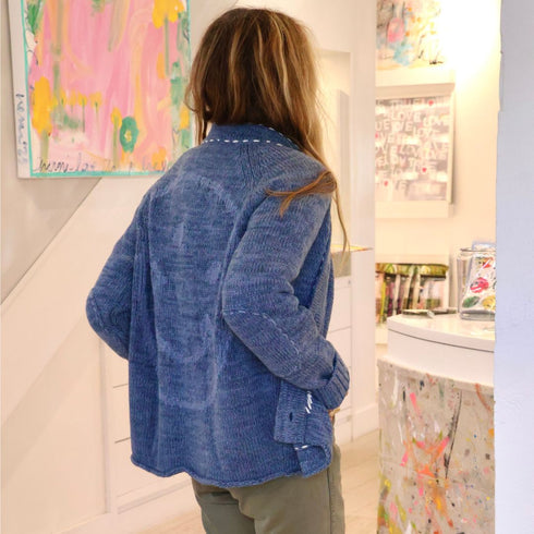 Blue women’s cardigan with tonal smiley face graphic on the back contrast stitching elbow patches and front pockets. Cute cardigans by Kerri Rosenthal