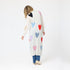 Cozy and colorful 100% cashmere long cardigan sweater duster with multicolored hand-stitched imperfect heart appliqués, front patch pockets, and ribbed cuffs.