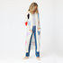 100% Cashmere long cardigan sweater duster with multicolored hand-stitched imperfect heart appliqués, front patch pockets, and ribbed cuffs.