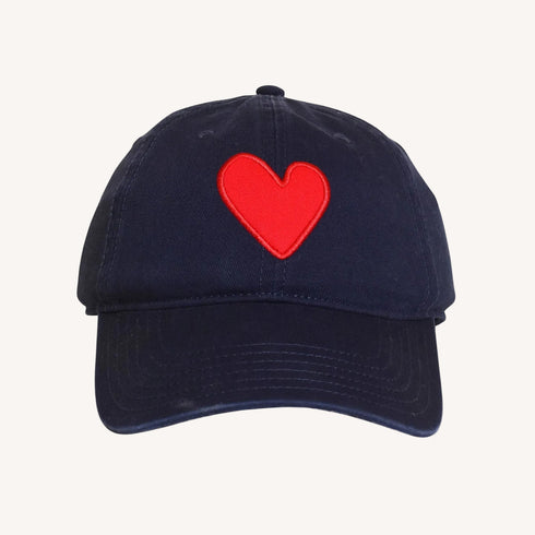 Navy blue cotton baseball cap hat with unique Imperfect heart patch and an adjustable belts.