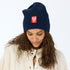 Love Brigade indigo blue beanie hat in a cotton-cashmere blend ribbed knit, featuring embroidered artwork - Shop cute women’s beanies by Kerri Rosenthal