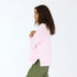 The Lovey light pink pullover sweater is made from 100% cotton with a contrast heart patch and relaxed fit - Shop cute women’s sweaters by Kerri Rosenthal
