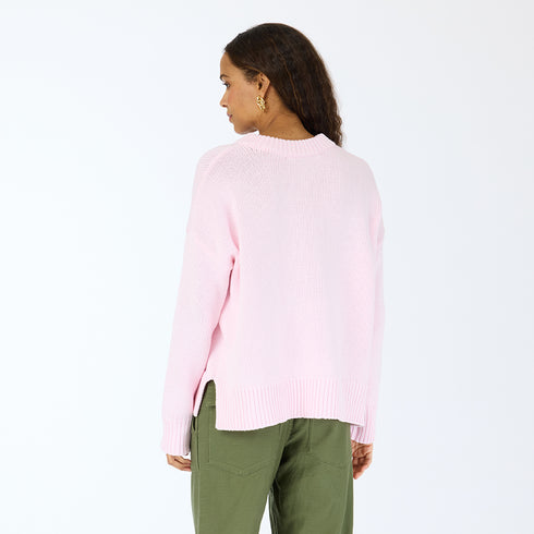 The Lovey light pink pullover sweater is made from 100% cotton with a contrast heart patch and relaxed fit - Shop cute women’s sweaters by Kerri Rosenthal