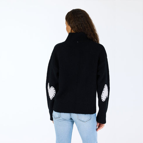 The Lucy mock-neck black sweater is made from a cashmere blend with heart patch elbows - Shop cute women’s sweaters by Kerri Rosenthal