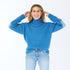 The Lucy mock-neck blue sweater is made from a cashmere blend with heart patch elbows - Shop cute women’s sweaters by Kerri Rosenthal