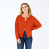 Bassett rust cashmere cardigan, features a round neck, covered contrast buttons, and embroidered 'Loved' artwork - Cute women's cardigans by Kerri Rosenthal