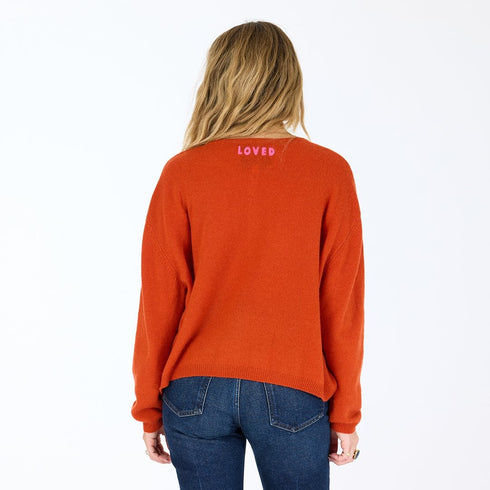 Bassett rust cashmere cardigan, features a round neck, covered contrast buttons, and embroidered 'Loved' artwork - Cute women's cardigans by Kerri Rosenthal